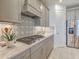 Well-equipped kitchen with modern stainless steel appliances and a decorative backsplash at 17146 Moonflower Dr, Venice, FL 34293
