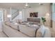 Comfortable living room with modern decor, stylish accent wall, and plush seating area with lots of light at 17146 Moonflower Dr, Venice, FL 34293