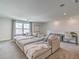 Comfortable living room featuring a large sectional sofa, desk area, and neutral decor at 17146 Moonflower Dr, Venice, FL 34293
