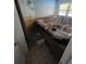 Bathroom featuring tile flooring, a large tub, and unique tropical mural at 1783 Mississippi Ne Ave, St Petersburg, FL 33703