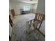 Spacious living room needing renovations with a large window bringing in natural light at 1783 Mississippi Ne Ave, St Petersburg, FL 33703