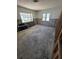 Spacious living room needing renovations and featuring a window at 1783 Mississippi Ne Ave, St Petersburg, FL 33703