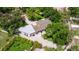 Aerial view of the house showing roof, patio, and surrounding landscape at 1800 Mound S Pl, St Petersburg, FL 33712