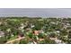 Aerial view showcasing the house surrounded by lush greenery and nearby waterfront at 1800 Mound S Pl, St Petersburg, FL 33712