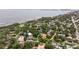 Stunning aerial view of a waterfront property nestled among lush greenery and serene water views at 1800 Mound S Pl, St Petersburg, FL 33712