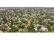 Expansive aerial view of a residential neighborhood surrounded by mature trees and well-maintained lawns at 1800 Mound S Pl, St Petersburg, FL 33712