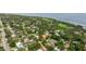 Breathtaking aerial view of a quiet residential neighborhood near a tranquil body of water at 1800 Mound S Pl, St Petersburg, FL 33712