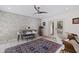Stylish dining area with decorative stone wall, modern table, and chairs at 1800 Mound S Pl, St Petersburg, FL 33712
