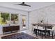 Bright dining area featuring a stone accent wall, modern furnishings, and a view to the outdoors at 1800 Mound S Pl, St Petersburg, FL 33712