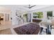 Open dining area with bar seating that connects to a modern kitchen at 1800 Mound S Pl, St Petersburg, FL 33712