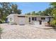 Charming home exterior with brick driveway and outdoor kitchen area at 1800 Mound S Pl, St Petersburg, FL 33712
