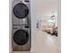 Modern washer and dryer units, with a glimpse into a bright and inviting living space at 1800 Mound S Pl, St Petersburg, FL 33712