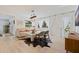 Sunlit living room featuring stylish furniture, decorative rug, and hardwood floors at 1800 Mound S Pl, St Petersburg, FL 33712