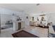 Open-concept living space featuring a dining area, kitchen island with wine cooler, and bright living area at 1800 Mound S Pl, St Petersburg, FL 33712