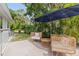Inviting outdoor patio featuring stylish wicker furniture, providing a comfortable space for relaxation at 1800 Mound S Pl, St Petersburg, FL 33712