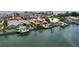 Aerial view of a waterfront home with a private dock and a well-manicured backyard at 1939 Hawaii Ne Ave, St Petersburg, FL 33703