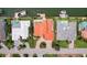 Aerial view of a luxury home with a private swimming pool, lush landscaping, and a circular driveway at 1939 Hawaii Ne Ave, St Petersburg, FL 33703