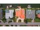 Aerial view of a luxury home with a private swimming pool, lush landscaping, and a circular driveway at 1939 Hawaii Ne Ave, St Petersburg, FL 33703