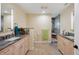Luxury bathroom with dual vanities, granite countertops, and a walk-in shower at 1939 Hawaii Ne Ave, St Petersburg, FL 33703