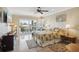 Bedroom with tile flooring, ceiling fan, and sliding doors to the outside patio at 1939 Hawaii Ne Ave, St Petersburg, FL 33703