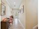 Inviting foyer with stone floors and elegant decor, leading to a bright living space at 1939 Hawaii Ne Ave, St Petersburg, FL 33703