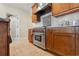 Stylish kitchen showcasing a professional-grade gas range and custom tile backsplash at 1939 Hawaii Ne Ave, St Petersburg, FL 33703