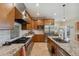 Chef's kitchen with a gas range, stainless steel hood, and high-end appliances at 1939 Hawaii Ne Ave, St Petersburg, FL 33703