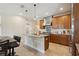 Gourmet kitchen featuring custom cabinetry, a center island, and modern lighting fixtures at 1939 Hawaii Ne Ave, St Petersburg, FL 33703