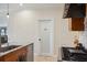 Well-lit kitchen with a pantry door, stainless steel appliances and countertop with a double bowl sink at 1939 Hawaii Ne Ave, St Petersburg, FL 33703