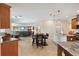 Open concept kitchen with stone flooring, modern lighting and stainless steel appliances at 1939 Hawaii Ne Ave, St Petersburg, FL 33703