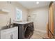 Laundry room with a countertop, sink, and stainless steel washer and dryer at 1939 Hawaii Ne Ave, St Petersburg, FL 33703