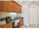 Dedicated home office space featuring custom wood cabinets and desk at 1939 Hawaii Ne Ave, St Petersburg, FL 33703