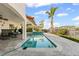 Beautiful backyard boasts a pool, lush landscaping, and outdoor seating for relaxation at 1939 Hawaii Ne Ave, St Petersburg, FL 33703