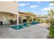 Backyard with pool, outdoor dining, and lush landscaping offers the perfect entertaining space at 1939 Hawaii Ne Ave, St Petersburg, FL 33703