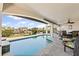 Beautiful covered patio overlooking a pristine pool and scenic waterfront at 1939 Hawaii Ne Ave, St Petersburg, FL 33703