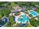 Aerial view of community pool area with sun loungers and sun shades at 20053 Heritage Point Dr, Tampa, FL 33647