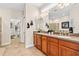 Luxurious bathroom with a double vanity, spacious countertop, and elegant fixtures at 20053 Heritage Point Dr, Tampa, FL 33647