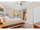 Cozy bedroom with a comfortable bed, window with natural light, and wooden wardrobe at 20053 Heritage Point Dr, Tampa, FL 33647