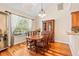 Elegant dining room featuring hardwood floors, natural lighting, and a classic china cabinet at 20053 Heritage Point Dr, Tampa, FL 33647