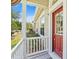 Welcoming front door with decorative wreath and covered porch, offering curb appeal and charm at 20053 Heritage Point Dr, Tampa, FL 33647