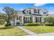 Charming two-story home with landscaped front yard, walkway, and covered porch at 20053 Heritage Point Dr, Tampa, FL 33647