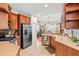 Bright kitchen with stainless steel appliances, granite countertops, and an adjacent dining area at 20053 Heritage Point Dr, Tampa, FL 33647