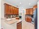 Well-equipped kitchen with wooden cabinets, tile backsplash, and stainless steel appliances at 20053 Heritage Point Dr, Tampa, FL 33647