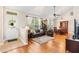 Bright living room boasts high ceilings, large windows, and hardwood flooring, filled with natural light at 20053 Heritage Point Dr, Tampa, FL 33647