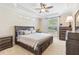 Elegant main bedroom showcasing a tray ceiling, plush carpet, and sophisticated furnishings at 20053 Heritage Point Dr, Tampa, FL 33647