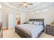 Comfortable main bedroom with a spacious layout, neutral tones, and easy access to the ensuite bathroom at 20053 Heritage Point Dr, Tampa, FL 33647