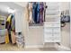 Organized walk-in closet with shelving, drawers, and ample hanging space for clothing and accessories at 20053 Heritage Point Dr, Tampa, FL 33647