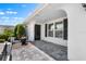 Charming entrance of the home with a well-manicured garden and paved walkway at 204 Cactusflower Ln, Sun City Center, FL 33573