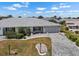 Well-maintained home with lush landscaping, a two-car garage and a charming front entrance at 204 Cactusflower Ln, Sun City Center, FL 33573