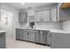 Bright updated kitchen with stainless steel appliances and neutral countertops at 204 Cactusflower Ln, Sun City Center, FL 33573